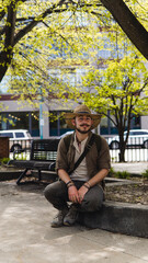 Obraz premium man sitting on park bench