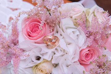 Bridal bouquet with pink roses, model of 2024 and wedding rings