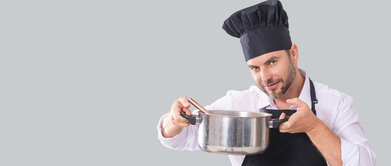 Handsome bearded male chef cook or baker man in uniform shirt posing isolated on yellow background, studio portrait. Cooking food concept. Chef Man in chef hat. Isolated portrait of man cooking.