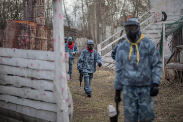Paintball. Gun and soldier with a sports man playing a military game for fun or training outdoor....