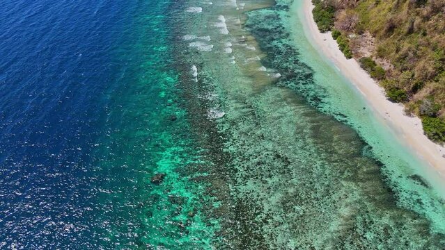 Drone footage following a long tropical beach near Palawan in the Philippines.