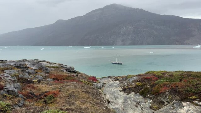 View of Harefjord with a three-masted schooner. Scoresbysund, Greenland.