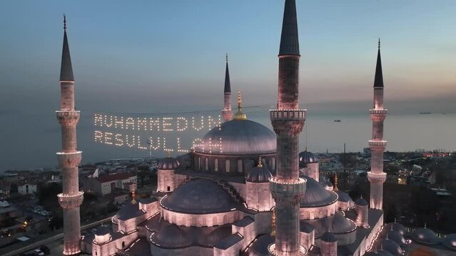 Blue Mosque (Sultanahmet Camii) Illuminated Letters Between Ramadan Month Minarets (Mahya) Drone Video,  Sultanahmet Square Fatih, Istanbul Turkiye (Turkey)