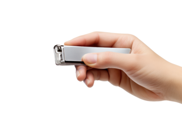 Hand Holding Small Metal Object. On a White or Clear Surface PNG Transparent Background..