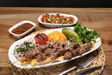 Lamb shish kebab served with bulgur pilaf