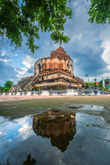 Obraz premium Wat Chedi Luang is a Buddhist temple in the historic centre and is a Buddhist temple is a major tourist attraction in Chiang Mai,Thailand.at twilight time blue sky clouds sunset background.