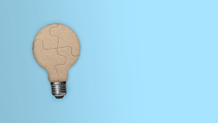 Closeup view of light bulb from a piece of the puzzle for unity and teamwork