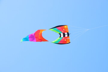 Colorful kite flying in the blue sky in summer at Mekong Delta Vietnam.