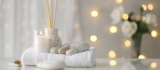 Spa products with flower candles and towels on the table