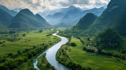 A winding river cutting through a lush valley - obrazy, fototapety, plakaty