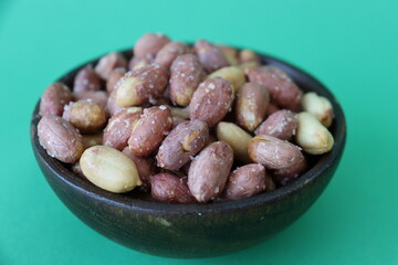 salted pistachios are displayed in traditional and glass containers