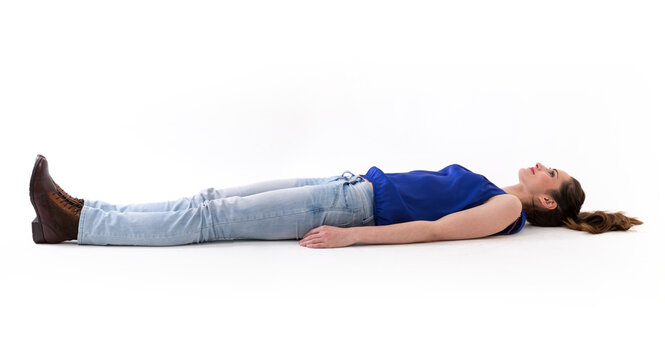Caucasian woman lying on floor.