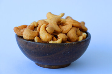 cashews are displayed in traditional and glass containers