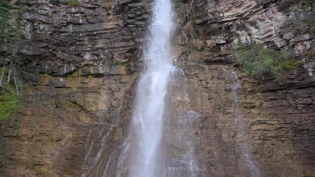 Virginia Falls waterfall in Glacier National Park, tilt up handheld