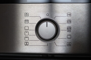 Setting Electric Oven Modes by Turning Switch Control Close Up, Oven program control dial closeup