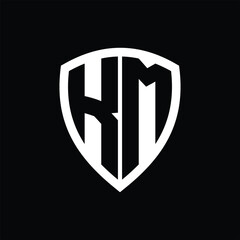 KM monogram logo with bold letters shield shape with black and white color design