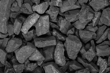 Coal. black crushed stone background texture close-up. rubble in a heap.