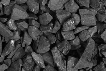 Coal. black crushed stone background texture close-up. rubble in a heap.