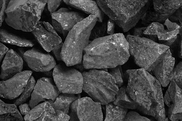 Coal. black crushed stone background texture close-up. rubble in a heap.