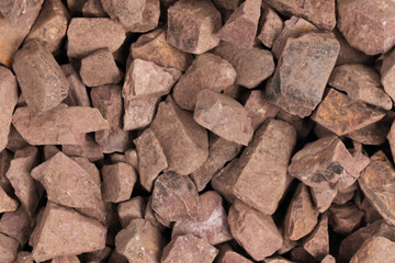 crushed stone crumb background texture close-up. rubble in a heap. natural decorative primer for designers. fraction