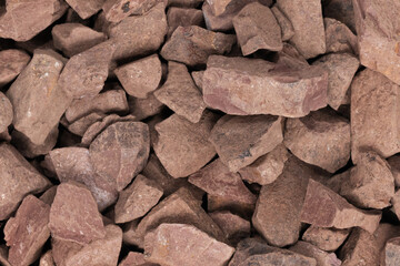 crushed stone crumb background texture close-up. rubble in a heap. natural decorative primer for designers. fraction