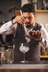 Expert bartender preparing a cocktail