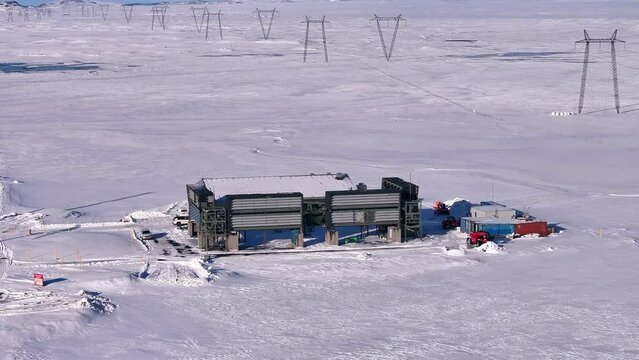 Aerial pan of Climeworks Orca, the first large-scale CO2 direct air capture site in Iceland's snowy landscape
