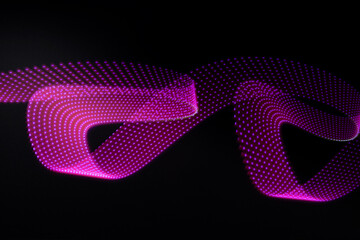 Pink and purple neon curved wave of light with dotted stripes on black background. Abstract background with motion light effect, light painting in New Year style.