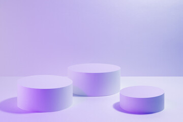 Abstract scene in pink violet vr neon light - three round podiums for cosmetic products mockup. Abstract stage for presentation skin care products, gifts, advertising, design, sale in hipster style.