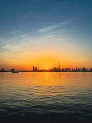 amazing sunset view of Dubai Downtown cityline from Dubai Creek harbour