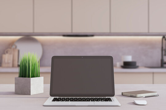 An open laptop with a blank screen sits on a modern kitchen table, showcasing a mockup for presentation or web platform design. 3D Rendering