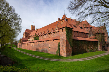 Fototapeta na wymiar The Castle of the Teutonic Order in Malbork, commonly known as Malbork Castle 