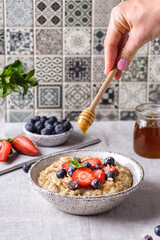 oatmeal porridge with berries and honey