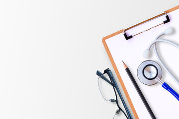 Top view with medical clipboard,pencil,blue stethoscope and glasses on white background.