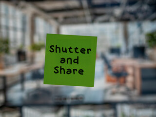 Post note on glass with 'Shutter and Share'.