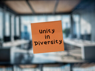 Post note on glass with 'Unity in Diversity'.