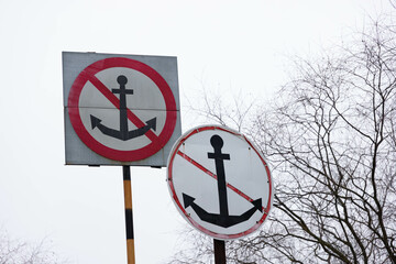 big sign no anchor on the river coast