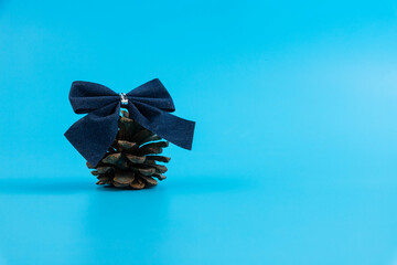 Christmas blue bow on a ring with place for text. Holiday concept. selective focus