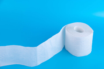 One toilet paper roll isolated on blue background