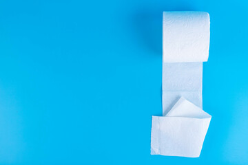 One toilet paper roll isolated on blue background