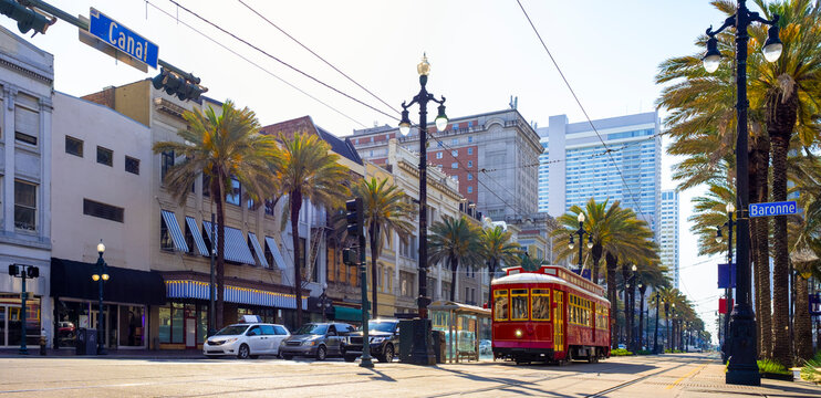 Trolley and cars on Canal street in New Orleans 