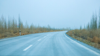 Hainan Mongolian and Tibetan Autonomous Prefecture, Qinghai Province-Grasslands and roads under the...