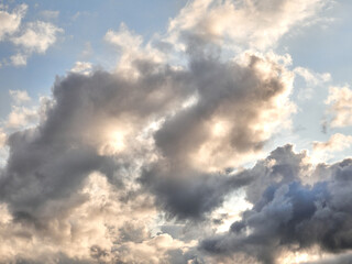 Fototapeta na wymiar White fluffy clouds in the deep blue sky. Heaven background