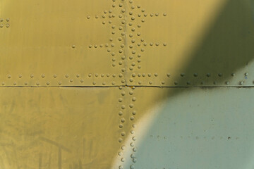 Rivets on the fuselage, helicopter body close-up.