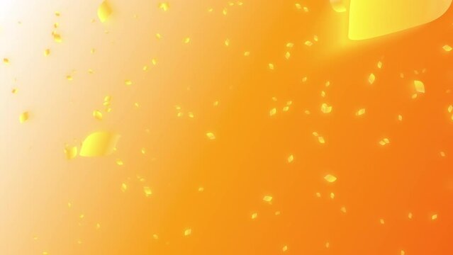 Orange colored autumn leaves falling from orange colored sunset sky background. Abstract background with a scene of autumn and early winter time.
