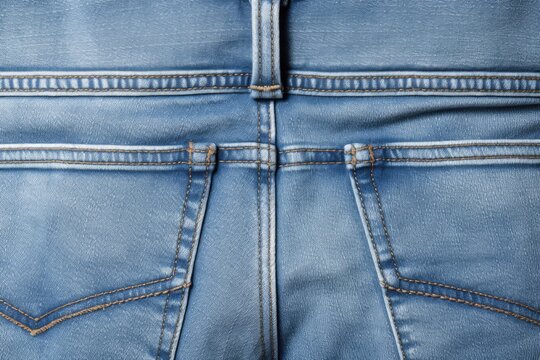Detailed close up of a pair of blue jeans. Suitable for fashion or textile industry concepts
