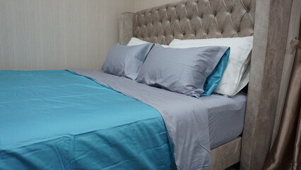 luxury beautiful color bedroom with comfort pillow cover bedding at hotel residence house curtain...