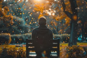 Fotobehang Man feeling sad and sitting in the park © Golden House Images