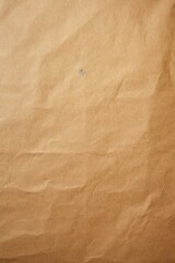 A piece of brown paper with a small hole. Suitable for various creative projects