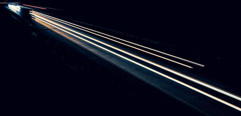 lights of cars driving at night. long exposure